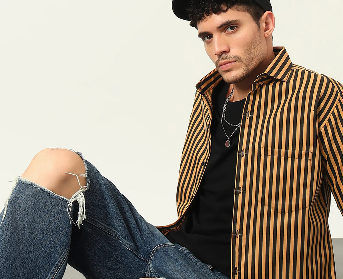 Man in a WOXEN yellow and black striped shirt